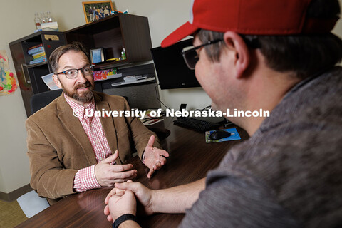 Todd Thornock, Associate Professor of Accountancy in the College of Business, speaks to a colleague 