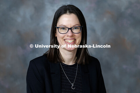 Studio portrait of Sarah Glover, Assistant Professor and Digital Archivist in University Libraries. 