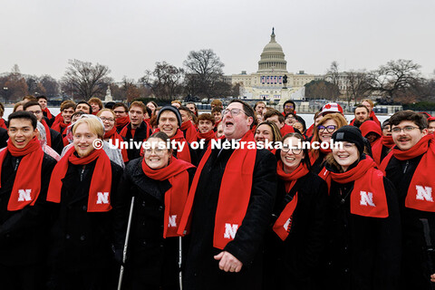 U.S. Congressman Mike Flood leads the UNL Choir in a ‘Go Big Red’ chant outside the United State