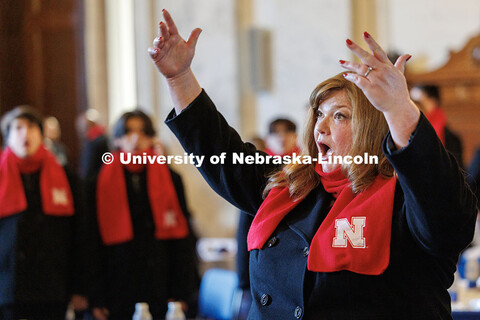 UNL’s Marci DeAmbrose directs the choir. Inauguration choir trip. January 20, 2025. 