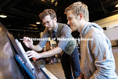 Adian Upton, left, junior theatre arts major, shows Micah Leary, graduate student in music where he 