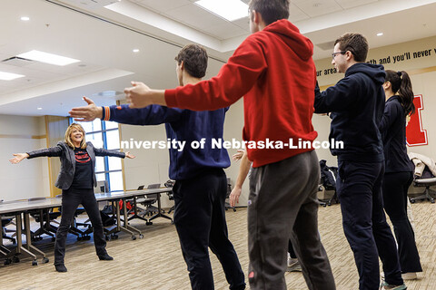 Julie Uribe, Lecturer in the College of Business, guides students through various warm-up activities