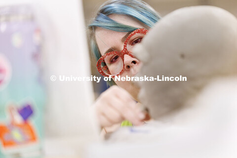 Sidney Sivill, senior Art major, works on modeling her clay head to resemble her reference photo dur