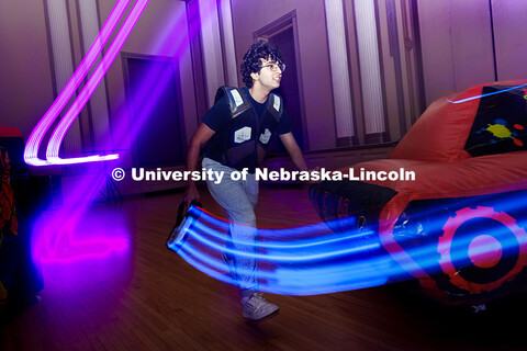 Narayana Pujara, freshman software engineering major, runs around obstacles during a round of laser 