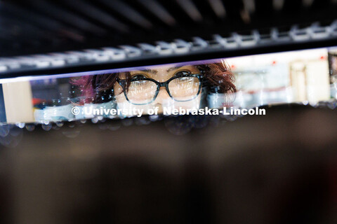 Luna Rivas, sophomore Integrated Science major, looks at the drinks at Herbie’s Market inside the 
