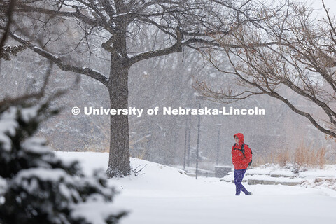 Student crossing campus as the snow falls. Snow on City Campus. February 17, 2025. 