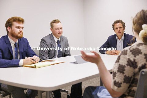 Lecturer Daniel Gutman talks with law students in the First Amendment Clinic. College of Law Clinics