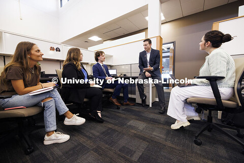 Professor Ryan Sullivan, center, talks with law students in the Estate Planning Clinic. College of L