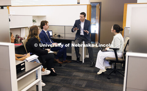 Professor Ryan Sullivan, center, talks with law students in the Estate Planning Clinic. College of L