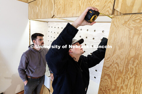Third year architecture students Ethan Watermeier, right, and Devyn Beekman take measurements to pla