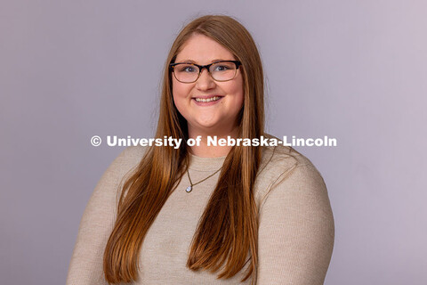 Studio portrait of Alex Dudley, Pre-Professional Coordinator for the Explore Center. May 1, 2025. 