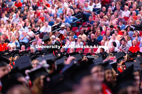 Marketing major Ben Hastreiter throws the bones to the crowd in Pinnacle Bank Arena as he's given a 