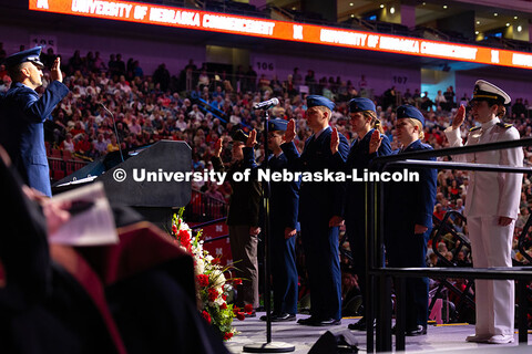 ROTC students give their Oath of Office during the morning commencement ceremony. Undergraduate Comm