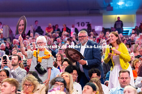 Family members cheer for a graduate during the morning commencement ceremony at Pinnacle Bank Arena.