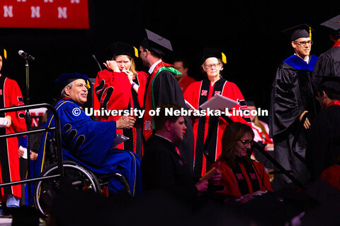 Construction Management graduate Quinny Brumbaugh shakes hands with College of Engineering Dean Lanc