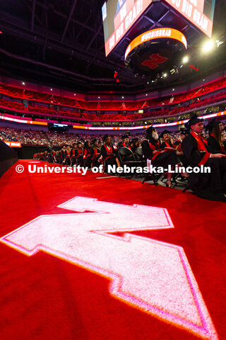 Graduates are seated in Pinnacle Bank Arena during the Saturday afternoon commencement ceremony. Und