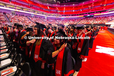 Dalia Gomez-Jura moves the tassel to the left side of her graduation cap toward the end of the Unive