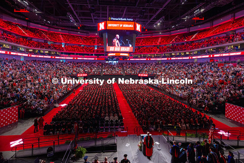 A nearly full Pinnacle Bank Arena listens as Rodney D. Bennett, Chancellor of University of Nebraska