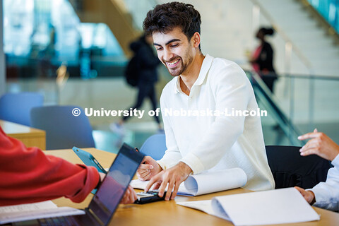 Parsa Jafarigeleh (left), a senior Construction Management major, studies with friends in Kiewit Hal