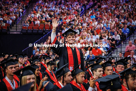 Management major and past Mascot, Brady Moylan, waves as he’s recognized for his years spent as He