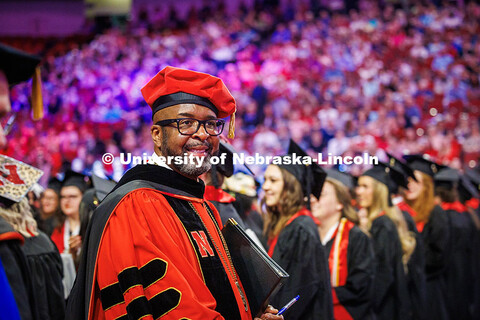 Chancellor Rodney D. Bennett smiles into the crowd after leaving the Undergraduate Commencement. May