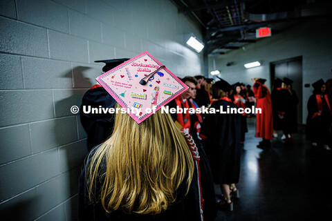 Biochemistry and French major, Emma Bitterman’s decorated grad cap reads “Biochemistry Barbie”