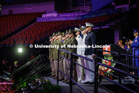 Graduating seniors of the ROTC stand on stage to be commissioned into the military post-graduation. 