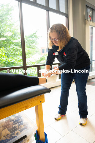 Jen Krueger, Senior Coordinator for Injury Prevention and Care, demonstrates how to wrap a foot afte