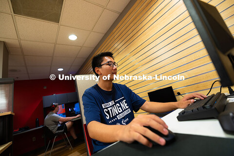 Tony Wang (right) and Westleigh Santema team up to play StarCraft against Devin Eno and his father, 