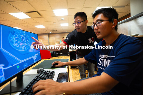 Tony Wang (right) and Westleigh Santema team up to play StarCraft against Devin Eno and his father, 
