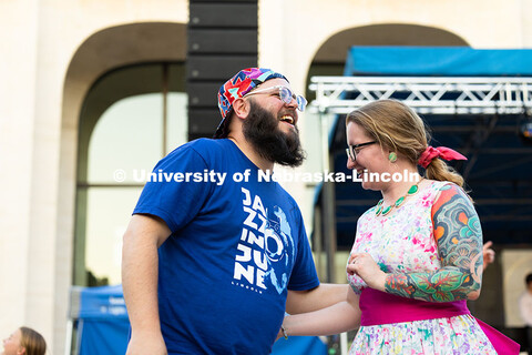 Jaz Schoeneck (left) and Kalee Holland dance in front of the stage to the music of singer Caity Gyor