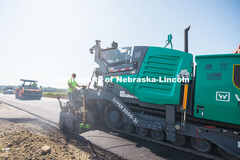 Construction crews pave Foundry Road in South Sioux City using asphalt made with recycled plastic ba