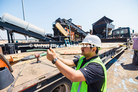 Nitish Bastola, PhD Civil Engineering student at UNL, documents the production of asphalt made with 