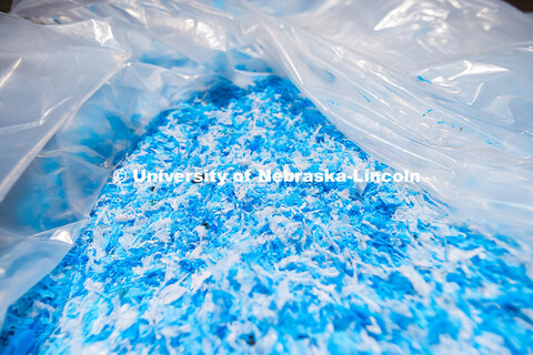Large piles of shredded plastic bags await being turned into asphalt. June 11, 2025. 
