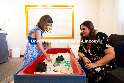 Jamie Buhrman, a first-year graduate student in Child, Youth and Family Studies, watches her daughte