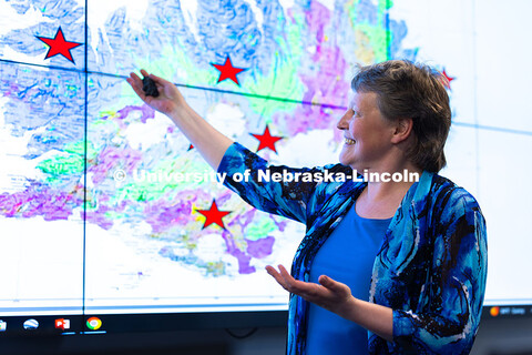 Irina Filina, associate professor of Earth and atmospheric sciences, points to locations in Iceland 