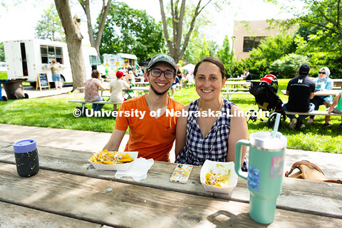 Jeff Newell and Season Cowley take a break for nachos during Discovery Days on June 14, on east camp