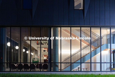 Chairs wrapped in plastic to protect against dust are pushed against the south windows of the new Fi