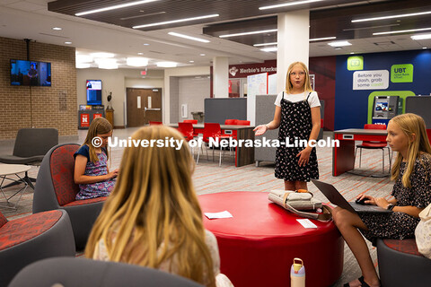 Lauren Macklin, 10, practices with her sisters and cousins before the Nebraska 4-H prepared speech j