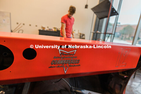 Custom graphics on the UNL Figure 8 Racing's 1980 Pontiac Firebird dashboard inside the Kiewitt Hall
