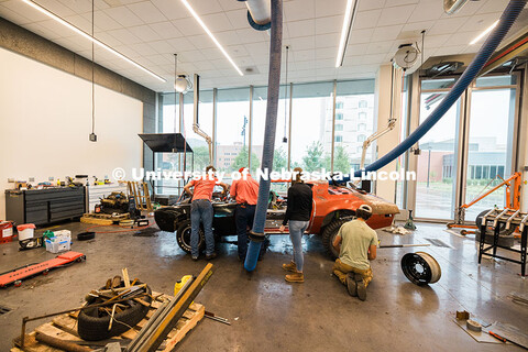 Members of the UNL Figure 8 Racing Team work on finishing touches inside the Kiewitt Hall Garage bef