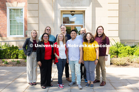 The Center for Academic Success and Transition team pose for a group photo outside of Love Library S
