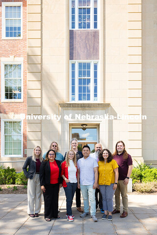 The Center for Academic Success and Transition team pose for a group photo outside of Love Library S