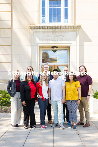 The Center for Academic Success and Transition team pose for a group photo outside of Love Library S