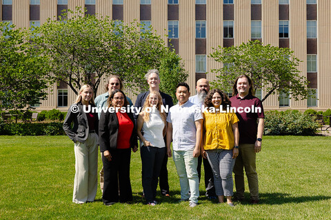 The Center for Academic Success and Transition team pose for a group photo outside of Love Library S