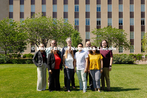 The Center for Academic Success and Transition team pose for a group photo outside of Love Library S