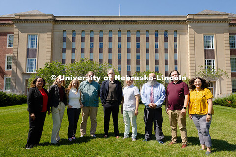 The Center for Academic Success and Transition team pose for a group photo outside of Love Library S