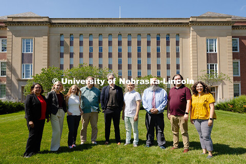 The Center for Academic Success and Transition team pose for a group photo outside of Love Library S