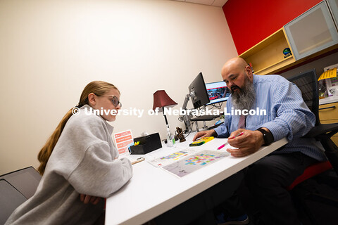 Joel Cardenas, an academic success coach in the Center for Academic Success and Transition, meets wi