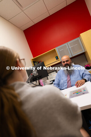 Joel Cardenas, an academic success coach in the Center for Academic Success and Transition, meets wi